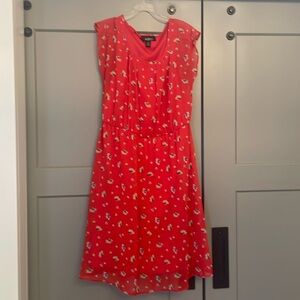 Red sleeveless mini dress. Lined. Fitted at waist
